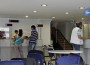People wait in front of the counters of an unemployment bureau in Athens People wait in front of the counters of an unemployment bureau in Athens